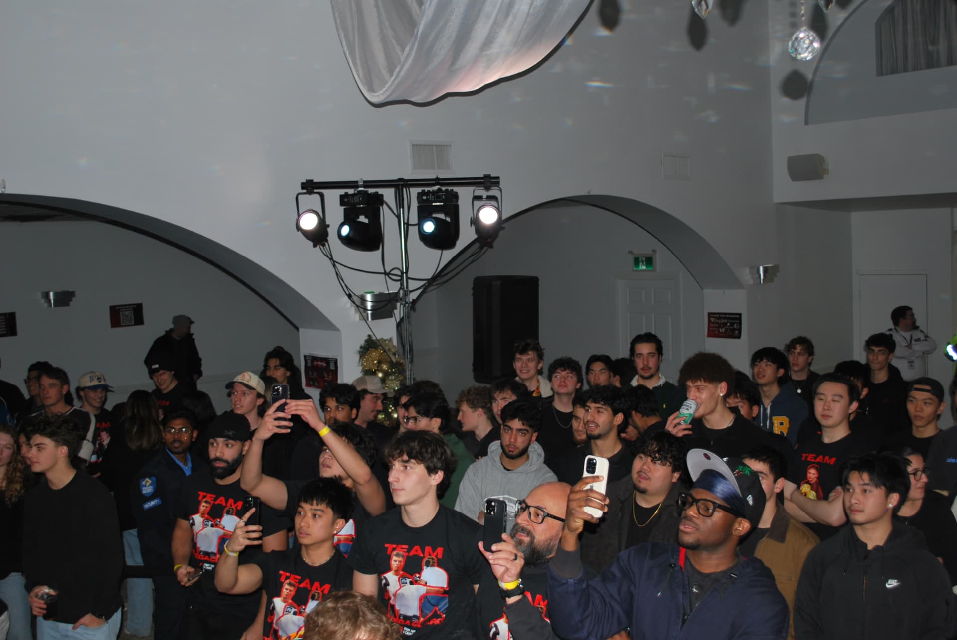 A large FFAC crowd gathered under event lighting