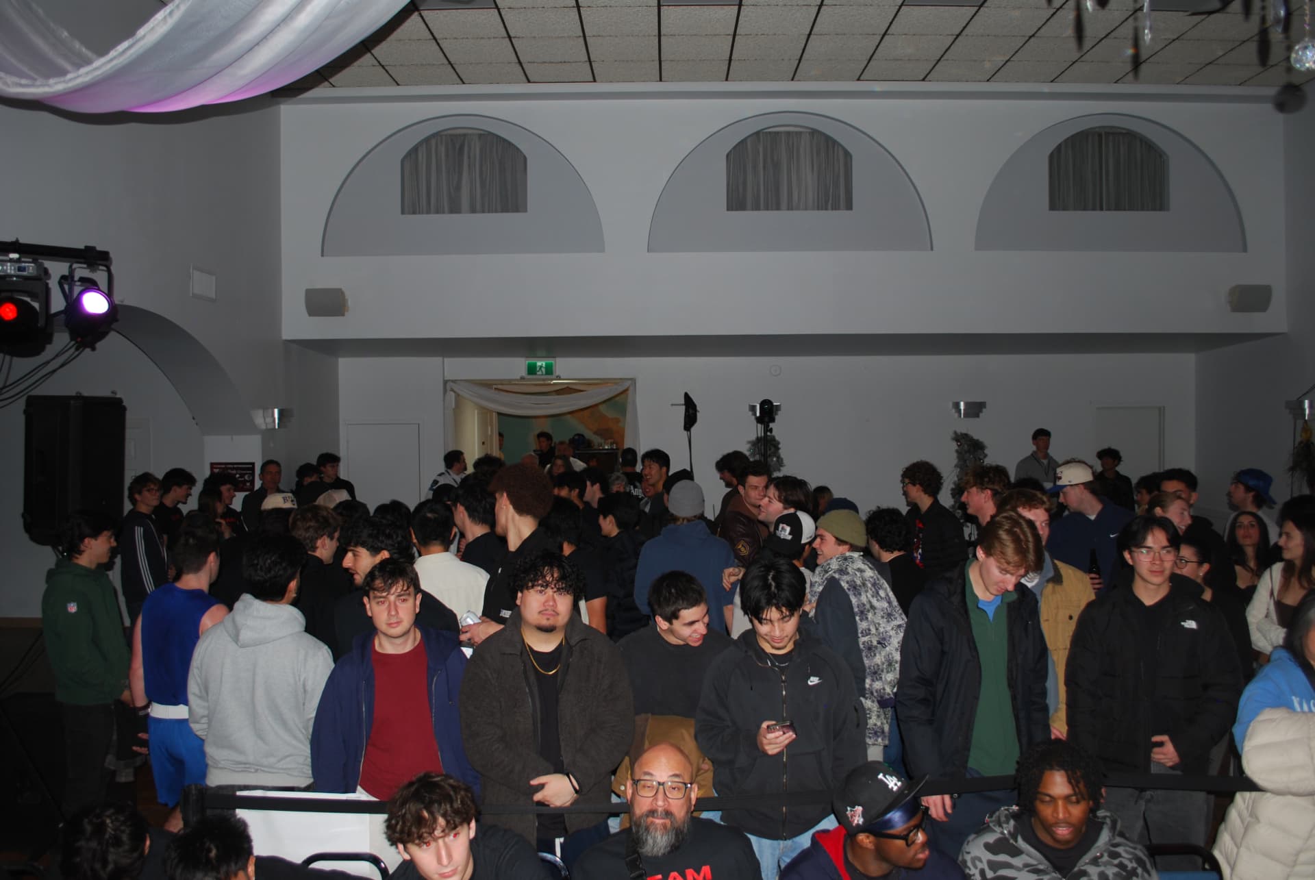 A packed room of students watching FFAC fight night