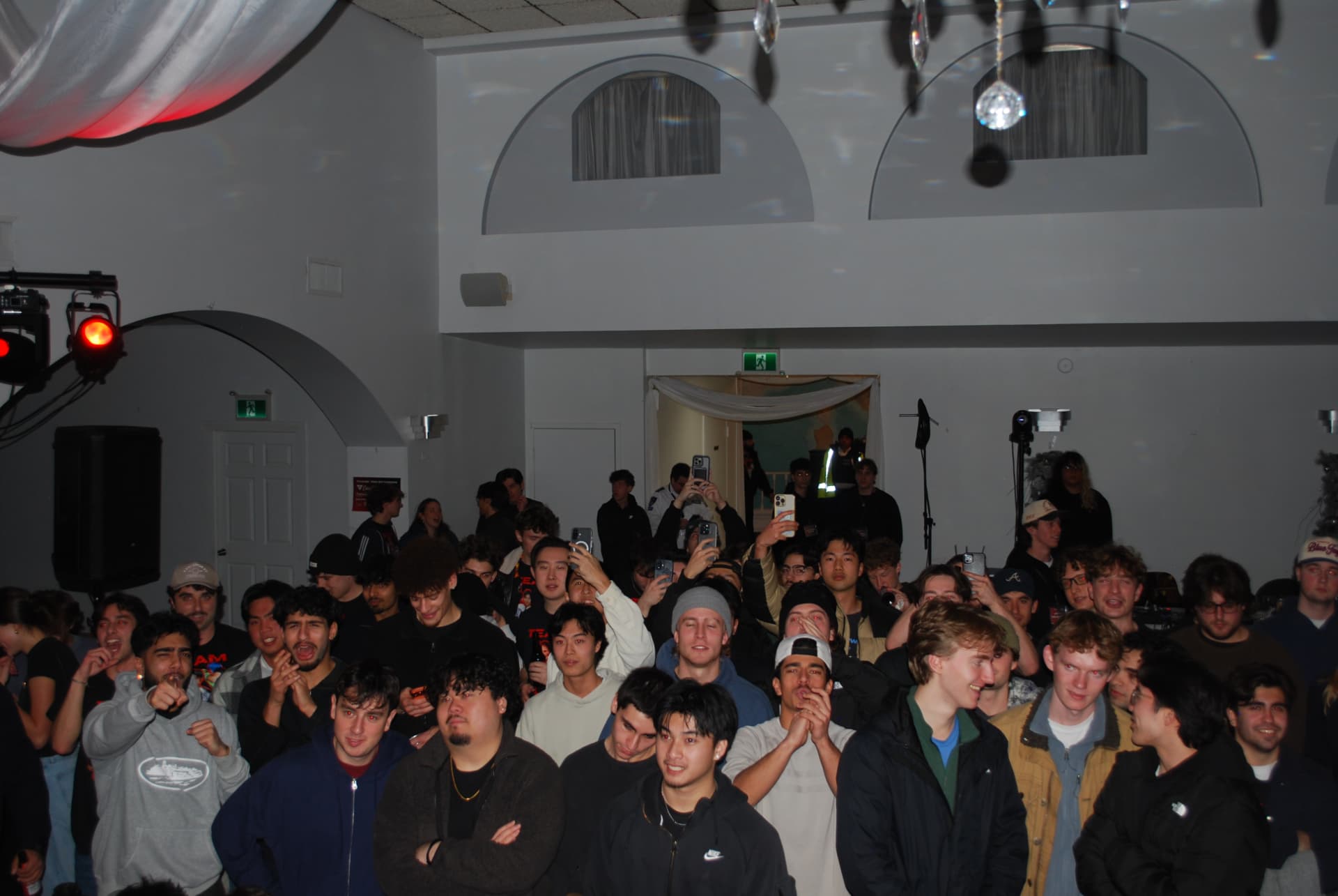 The FFAC crowd under stage lighting during fight night